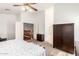 Bedroom with neutral carpeting and generous space, located near the staircase and an adjacent bathroom at 1805 E Sagebrush St, Gilbert, AZ 85296