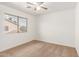 Empty bedroom featuring neutral carpet, a ceiling fan, and a window for natural light at 1805 E Sagebrush St, Gilbert, AZ 85296