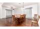 Spacious dining room with wood flooring, and seating for ten at 1805 E Sagebrush St, Gilbert, AZ 85296