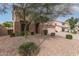 Two-story home with rock landscaping and a well maintained lawn at 1805 E Sagebrush St, Gilbert, AZ 85296
