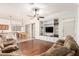 Open-concept living room showcasing tile flooring, ceiling fan and hard wood floors at 1805 E Sagebrush St, Gilbert, AZ 85296