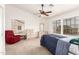 Large main bedroom with windows, dresser, ceiling fan, and neutral carpeting at 1805 E Sagebrush St, Gilbert, AZ 85296