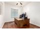 Bright office with a wooden desk, hardwood floors, and natural light from the window at 1805 E Sagebrush St, Gilbert, AZ 85296