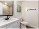 Updated bathroom with a modern vanity, sleek fixtures, and decorative wall art, creating a stylish and comfortable space at 1900 S Coconino Dr, Apache Junction, AZ 85120