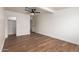 Bright bedroom with wood flooring, ceiling fan, and two closets at 1900 S Coconino Dr, Apache Junction, AZ 85120