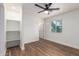 Light and bright bedroom featuring modern ceiling fan, wood floors, and large closet at 1900 S Coconino Dr, Apache Junction, AZ 85120