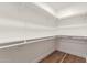Walk-in closet with custom shelving and wood floors at 1900 S Coconino Dr, Apache Junction, AZ 85120