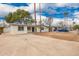 Charming single story home featuring fresh paint, a blue front door, and an expansive front yard at 1900 S Coconino Dr, Apache Junction, AZ 85120
