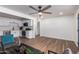Open concept living room featuring hardwood floors, recessed lighting, and a kitchen pass through at 1900 S Coconino Dr, Apache Junction, AZ 85120