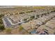 Scenic aerial view of neighborhood featuring houses with tile roofs and some with solar panels at 19013 E Seagull Dr, Queen Creek, AZ 85142