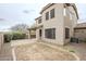 Two-story home with a large backyard featuring a covered patio and landscaping potential at 19013 E Seagull Dr, Queen Creek, AZ 85142