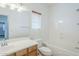 Bright bathroom featuring a combination tub and shower and single sink vanity at 19013 E Seagull Dr, Queen Creek, AZ 85142