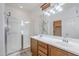Bright bathroom features a double sink vanity, glass shower, and ample lighting at 19013 E Seagull Dr, Queen Creek, AZ 85142