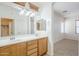 Double sink vanity offers ample space in a bright bathroom with neutral flooring at 19013 E Seagull Dr, Queen Creek, AZ 85142