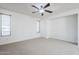 Large bedroom with carpet, ceiling fan, and lots of natural light at 19013 E Seagull Dr, Queen Creek, AZ 85142