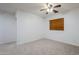 Spacious bedroom featuring carpeted floors, white walls, and a ceiling fan at 19013 E Seagull Dr, Queen Creek, AZ 85142