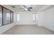 Spacious bedroom with carpet, ceiling fan, and lots of natural light at 19013 E Seagull Dr, Queen Creek, AZ 85142