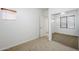 Carpeted bedroom with mirrored closet doors and a window with blinds at 19013 E Seagull Dr, Queen Creek, AZ 85142
