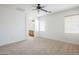 Bright bedroom offering neutral carpet and an ensuite bathroom entrance at 19013 E Seagull Dr, Queen Creek, AZ 85142