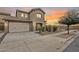 Charming home featuring a two-car garage, desert landscaping, and a welcoming front entrance at 19013 E Seagull Dr, Queen Creek, AZ 85142