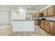 Kitchen featuring wood cabinets, stainless steel appliances and a breakfast bar at 19013 E Seagull Dr, Queen Creek, AZ 85142