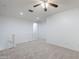 Carpeted second-floor landing with white walls and a ceiling fan at 19013 E Seagull Dr, Queen Creek, AZ 85142