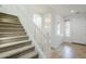 Inviting staircase with carpeted steps and white railings leading to the upper level of the home at 19013 E Seagull Dr, Queen Creek, AZ 85142