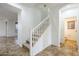 Open staircase featuring carpeted steps and white railings, connecting the home's levels at 19013 E Seagull Dr, Queen Creek, AZ 85142