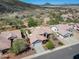 Stunning aerial view of a desert home showcasing the tile roof, landscaping, and surrounding community at 20630 N 42Nd Ave, Glendale, AZ 85308