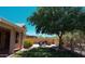 A serene backyard featuring a lush lawn, built-in BBQ, and a private seating area at 20630 N 42Nd Ave, Glendale, AZ 85308