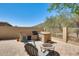 Charming backyard with brick patio, fire pit, and built-in barbecue, perfect for outdoor gatherings at 20630 N 42Nd Ave, Glendale, AZ 85308