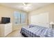 Cozy bedroom with a ceiling fan and a double door closet at 20630 N 42Nd Ave, Glendale, AZ 85308