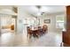 Spacious dining room with large table, ceiling fan, and arched doorway at 20630 N 42Nd Ave, Glendale, AZ 85308