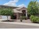 Charming single-story home with desert landscaping, a tile roof, and mature shade trees in a sunny neighborhood at 20630 N 42Nd Ave, Glendale, AZ 85308