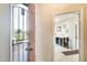 Open foyer with security door and view to the workshop with ample lighting and storage at 20630 N 42Nd Ave, Glendale, AZ 85308