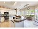 Beautiful kitchen features white cabinets, stainless steel appliances, and a breakfast nook at 20630 N 42Nd Ave, Glendale, AZ 85308