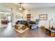 Spacious living room featuring hardwood floors, high ceilings, and a ceiling fan at 20630 N 42Nd Ave, Glendale, AZ 85308