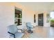 Inviting covered patio with comfortable seating, perfect for enjoying the outdoors and neighborhood views at 20630 N 42Nd Ave, Glendale, AZ 85308
