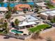 Beautiful property with an inviting pool, green lawn, and covered patio for ultimate outdoor enjoyment at 2077 N Lake Shore Dr, Casa Grande, AZ 85122