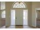 View of the front entrance door with glass panels and tile flooring at 2077 N Lake Shore Dr, Casa Grande, AZ 85122