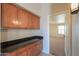 Hallway featuring cabinets with granite countertop, creating a functional transition space at 2077 N Lake Shore Dr, Casa Grande, AZ 85122