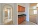 Hallway featuring cabinets with granite countertop, creating a functional transition space at 2077 N Lake Shore Dr, Casa Grande, AZ 85122