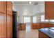 Modern kitchen featuring stainless steel appliances, granite countertops, and ample wooden cabinetry at 2077 N Lake Shore Dr, Casa Grande, AZ 85122