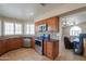 Well-equipped kitchen with stainless steel appliances, granite countertops, and wooden cabinets at 2077 N Lake Shore Dr, Casa Grande, AZ 85122