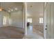 Inviting living room with large windows and lots of natural light that enters from the front door at 2077 N Lake Shore Dr, Casa Grande, AZ 85122