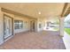 Spacious covered patio with tile flooring and access to backyard and home at 2077 N Lake Shore Dr, Casa Grande, AZ 85122