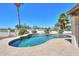 Relaxing in-ground pool area with desert landscaping and clear blue skies at 2077 N Lake Shore Dr, Casa Grande, AZ 85122