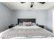 Bedroom with a ceiling fan and decorative bed at 23359 W Cocopah St, Buckeye, AZ 85326