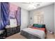 Bedroom with a ceiling fan, dresser and window at 23359 W Cocopah St, Buckeye, AZ 85326