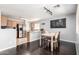 Eat-in kitchen features stainless steel appliances, wood cabinets, and adjacent dining area at 23359 W Cocopah St, Buckeye, AZ 85326